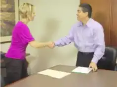 A man and woman shaking hands. Legal Human Resource Support - Vision Law