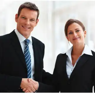 A man and woman shaking hands. Image representing a free employment law consultation for California employers - Vision Law